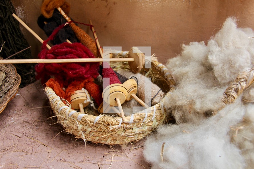 Fleece and wooden bobbins used to handcraft thread 