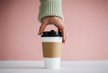 hand taking a coffee cup 