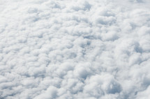 Fluffy, white clouds from above. 