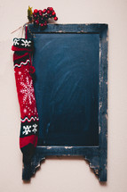 chalkboard with a Christmas stocking 
