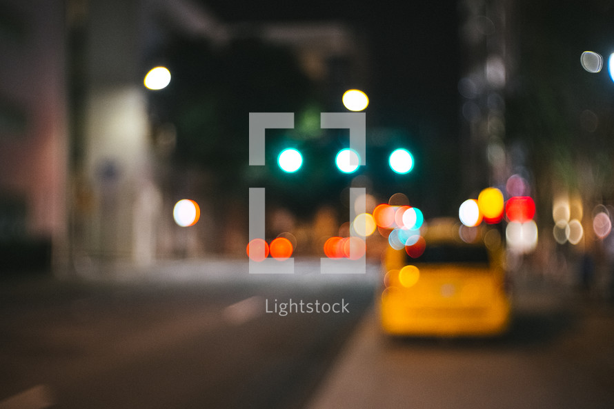 bokeh lights on a street at night 