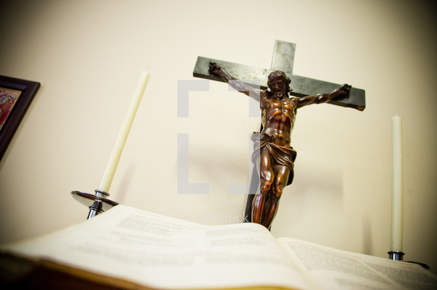 Crucifix and open Bible at an altar 