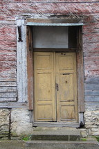 Door on an old deserted building 
