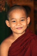 Smiling face of a novice monk