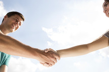 a hand shake between two people.