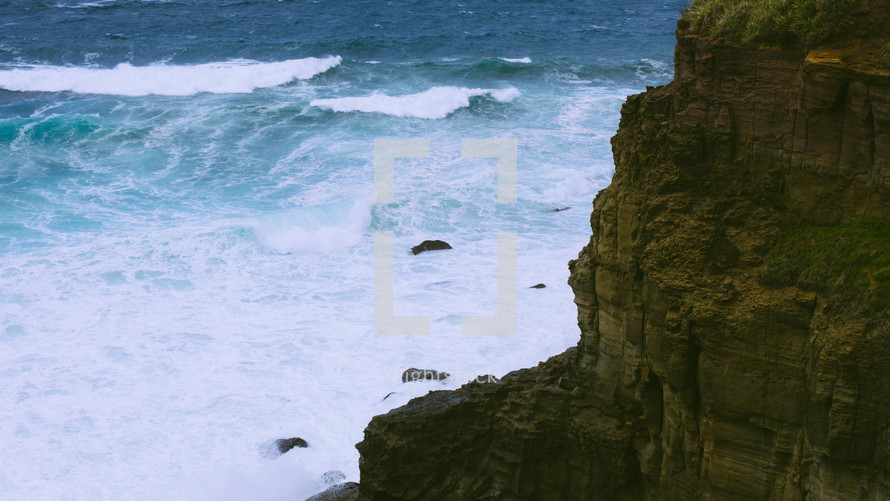 Rocky cliffs by the ocean.