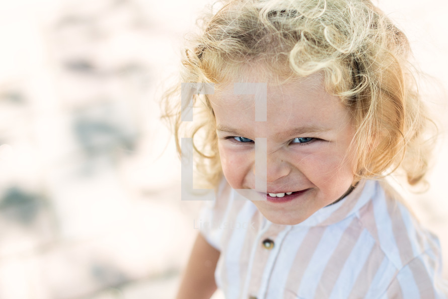 face of a little girl outdoors in summer 