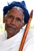 Ethiopian Orthodox woman holding a prayer cane [For similar search Ethnic Smile Face].