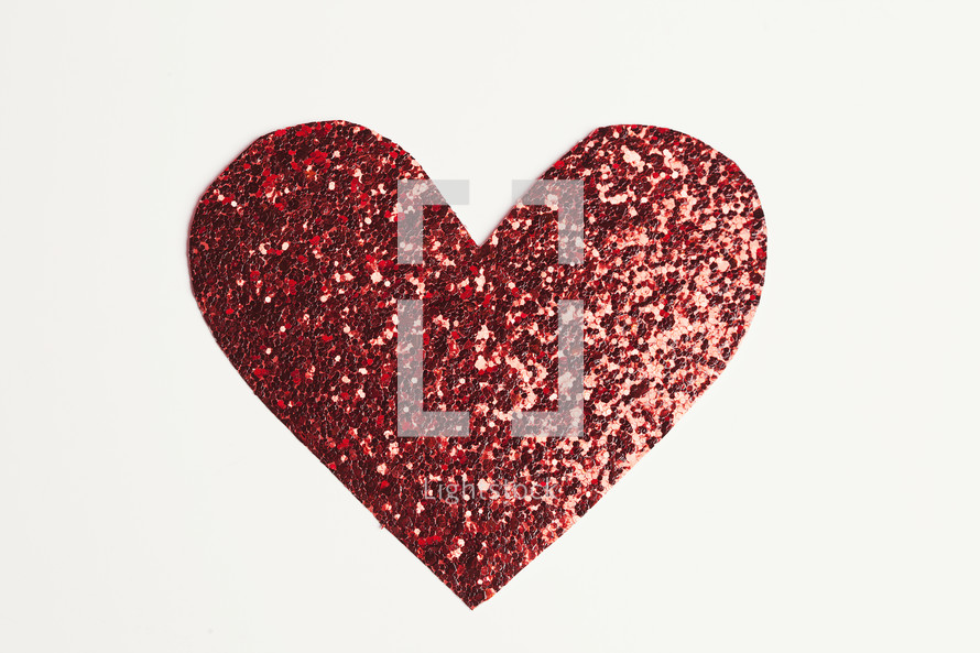 A red glittery paper heart cut-out 