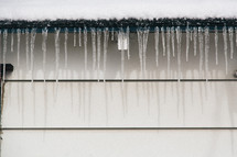 icicles hanging from a gutter 
