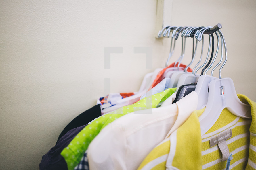 clothes on the rack in a store 