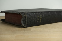 An old well worn Bible on a table
