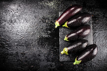 Fresh homemade eggplant on the table. On a wooden background. High quality photo