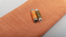 color threads on the orange fabric