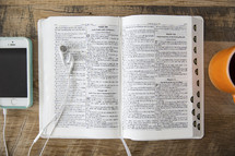 iPod, earbuds, open Bible, reading, podcast, coffee, coffee mug
