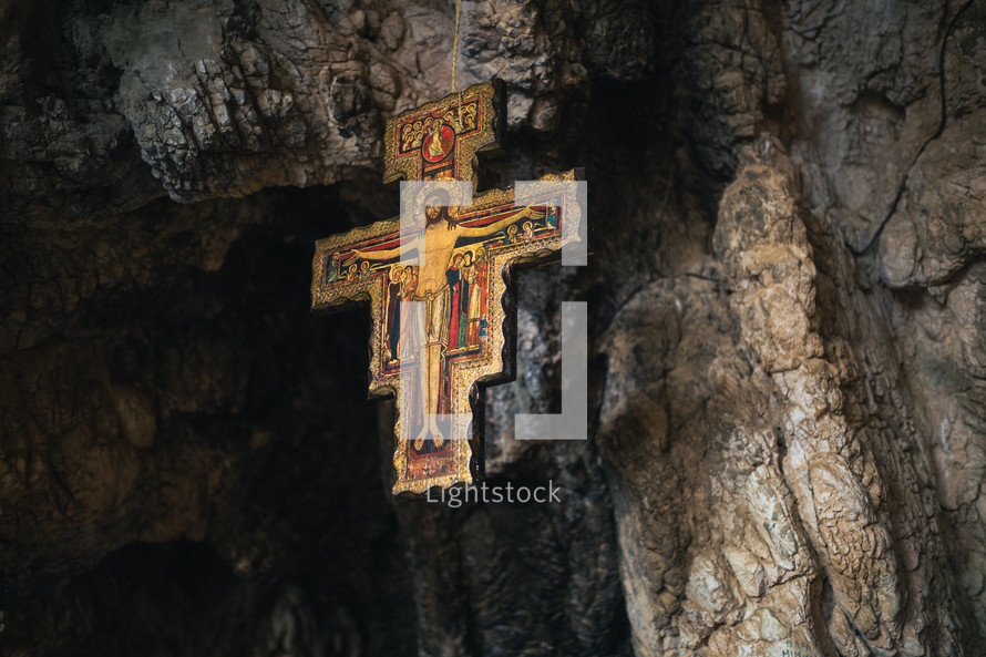 Ancient Crucifix hanging from the top of a cavern 