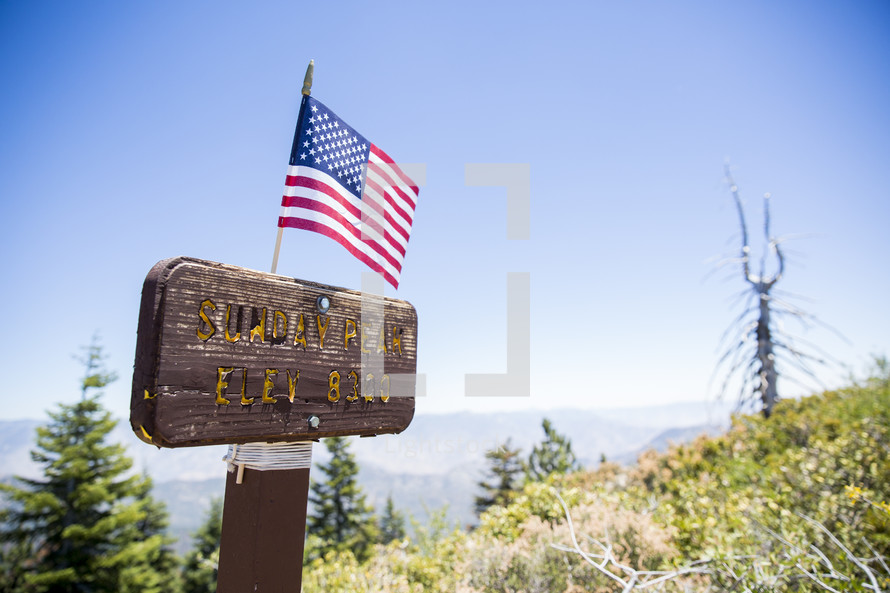 American flag on a sign for Sunday Peak 