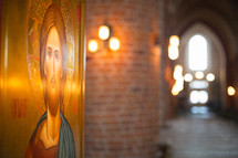 An icon of Christ in a church hallway 