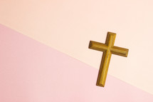 cross on a peach and pink background 