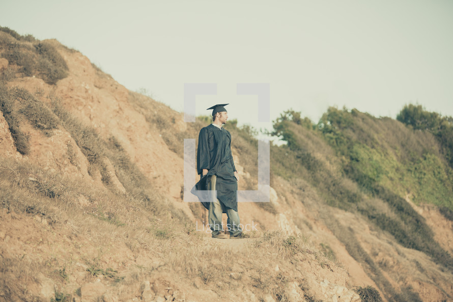 graduate on a cliff 