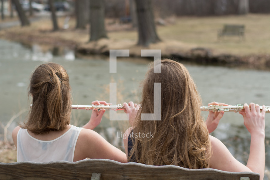 girls playing flutes 