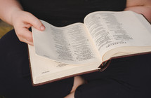 a child reading a Bible 