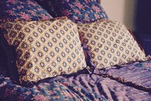 pillows on a made bed 