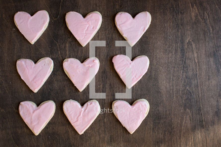 pink icing on heart shaped cookies 