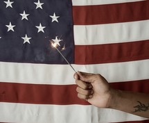 sparkler and an American flag 