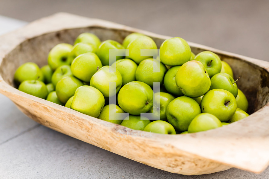 Basket of green apples.
