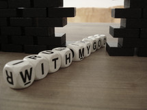 Letter blocks spelling out "with my God/"