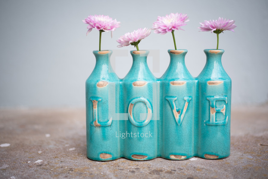 love vase with pink flowers