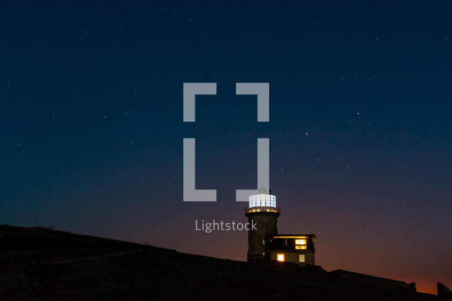light from a lighthouse at night 