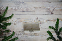 pine border and wrapped Christmas gift 