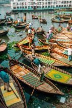 Boats with fishermen in Dhaka river in Bangladesh