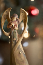 Christmas angel with bokeh backgound.
