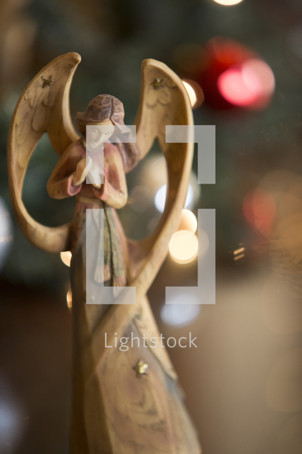 Christmas angel with bokeh backgound.