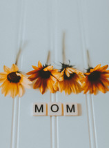 yellow flowers and the word mom 
