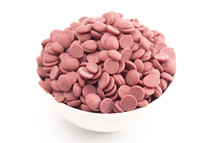 bowl of Authentic Ruby Chocolate Drops on a white Counter