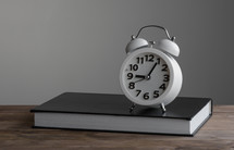 alarm clock on a journal 