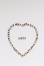 scrabble pieces in the shape of a heart 
