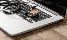 stethoscope on a laptop computer 