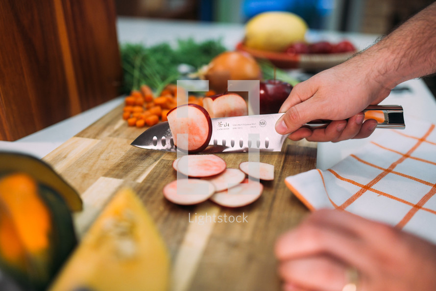 chopping vegetables in a kitchen 