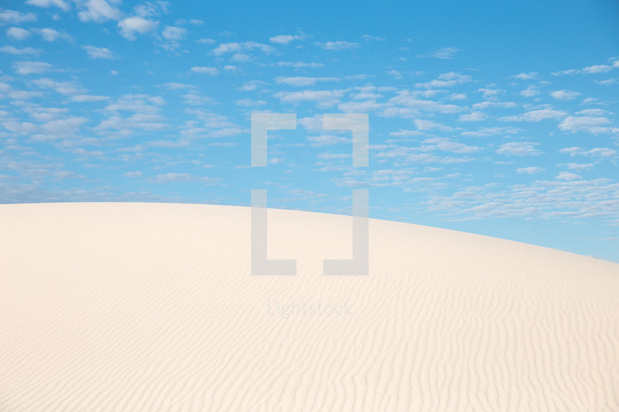 sand dunes under a blue sky 