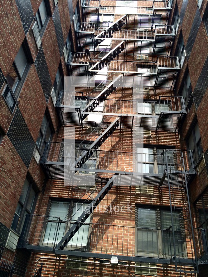 fire escape stairs on a brick building 