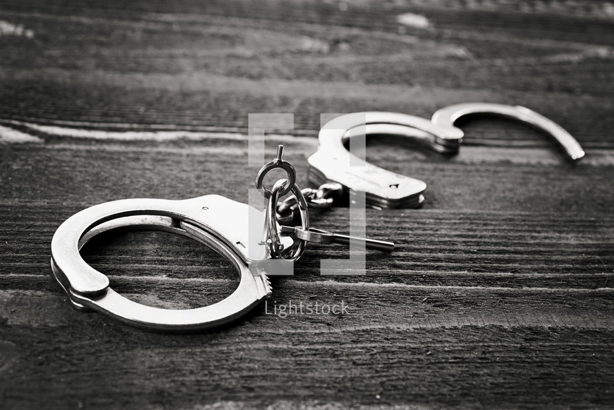 handcuffs on wood 