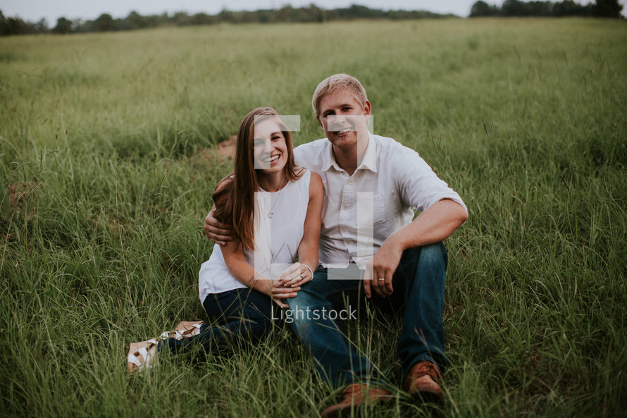 couple sitting in grass