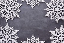 border of snowflakes on gray