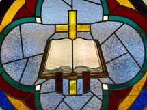 Stained glass window of a Bible 