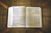 pages of an open Bible on a table 